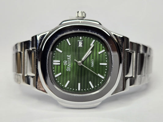 Silver watch with a green face on a white background